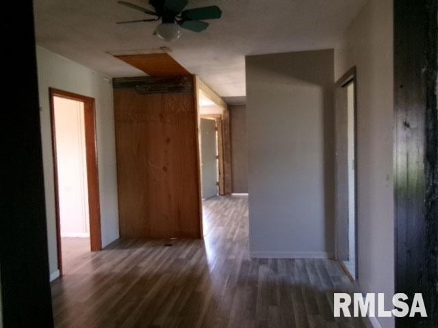 corridor featuring wood finished floors