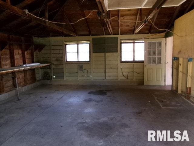 basement with a garage and plenty of natural light