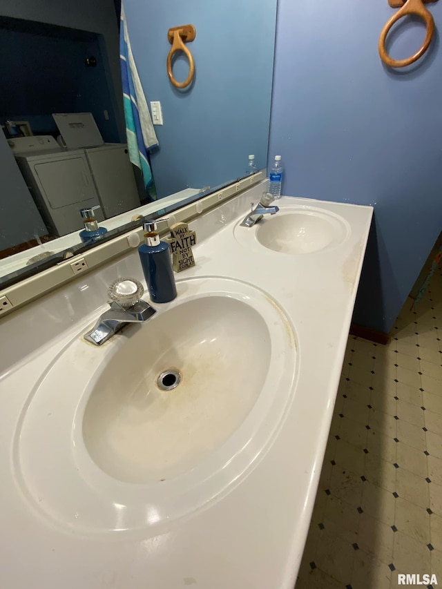 bathroom featuring double vanity and a sink