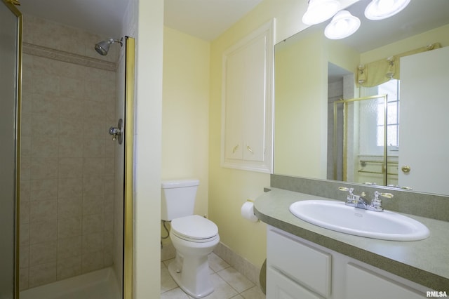 bathroom featuring a shower stall, toilet, tile patterned flooring, and vanity