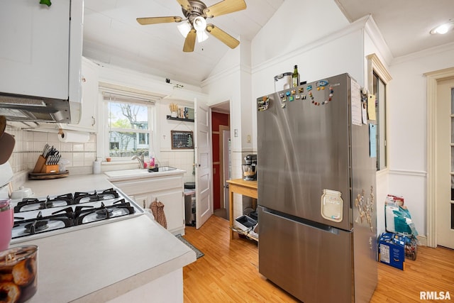 kitchen featuring light wood-style floors, ceiling fan, light countertops, and freestanding refrigerator