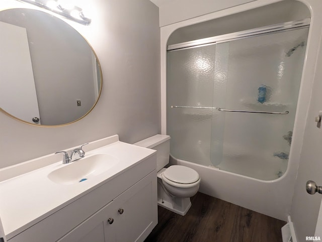 3809 N Fisk Rd, Astoria, IL 61501 - full bath featuring shower / bath combination with glass door, wood finished floors, toilet, and vanity