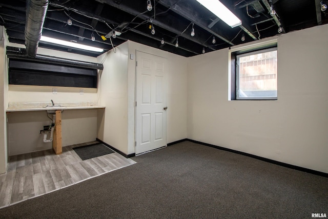 below grade area with carpet floors and baseboards