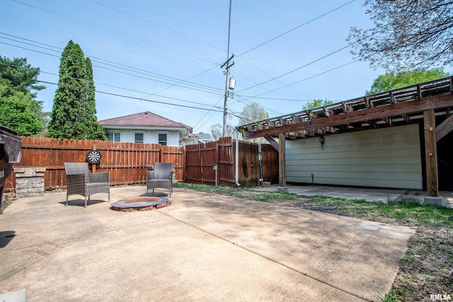 view of patio featuring a gate and fence