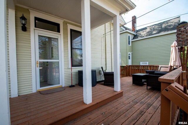 wooden deck featuring central air condition unit