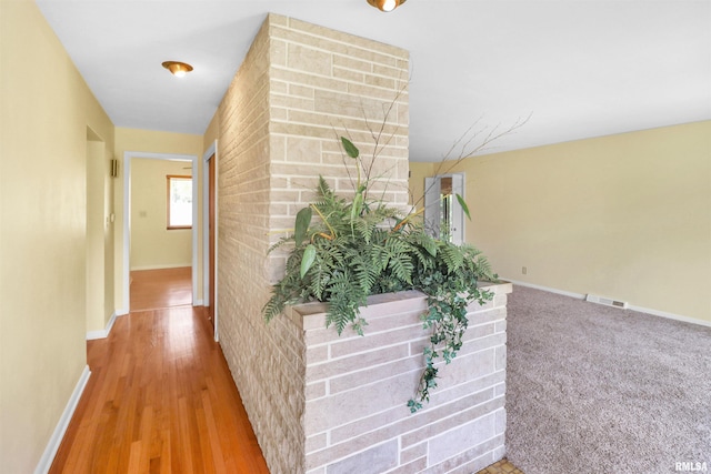 corridor with visible vents and baseboards