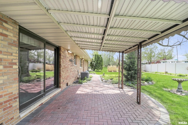 view of patio / terrace featuring fence and central AC