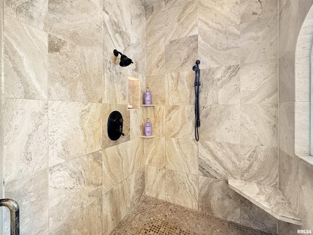 room details featuring a tile shower