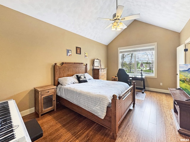 bedroom with wood finished floors, a ceiling fan, baseboards, and lofted ceiling