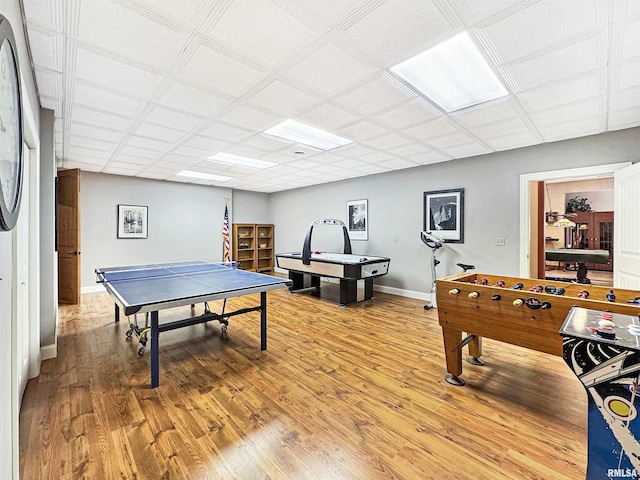 game room featuring light wood-style floors and baseboards