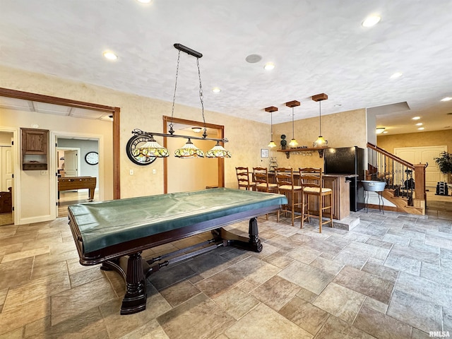 playroom with pool table, baseboards, a bar, stone tile flooring, and recessed lighting
