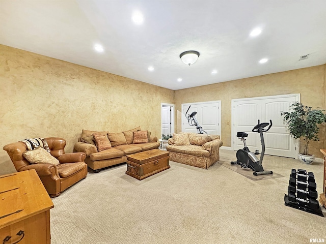 living room with light carpet, recessed lighting, and visible vents