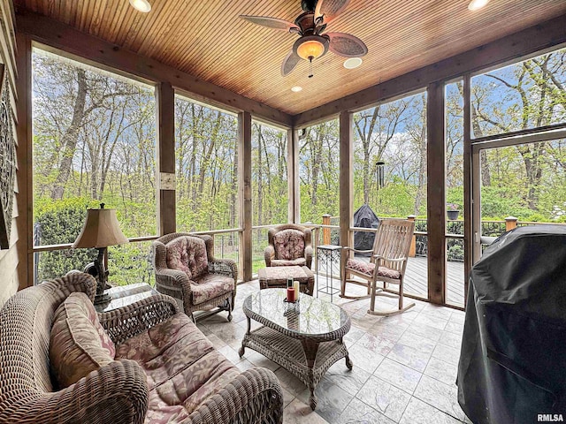 sunroom with an outdoor hangout area and a ceiling fan