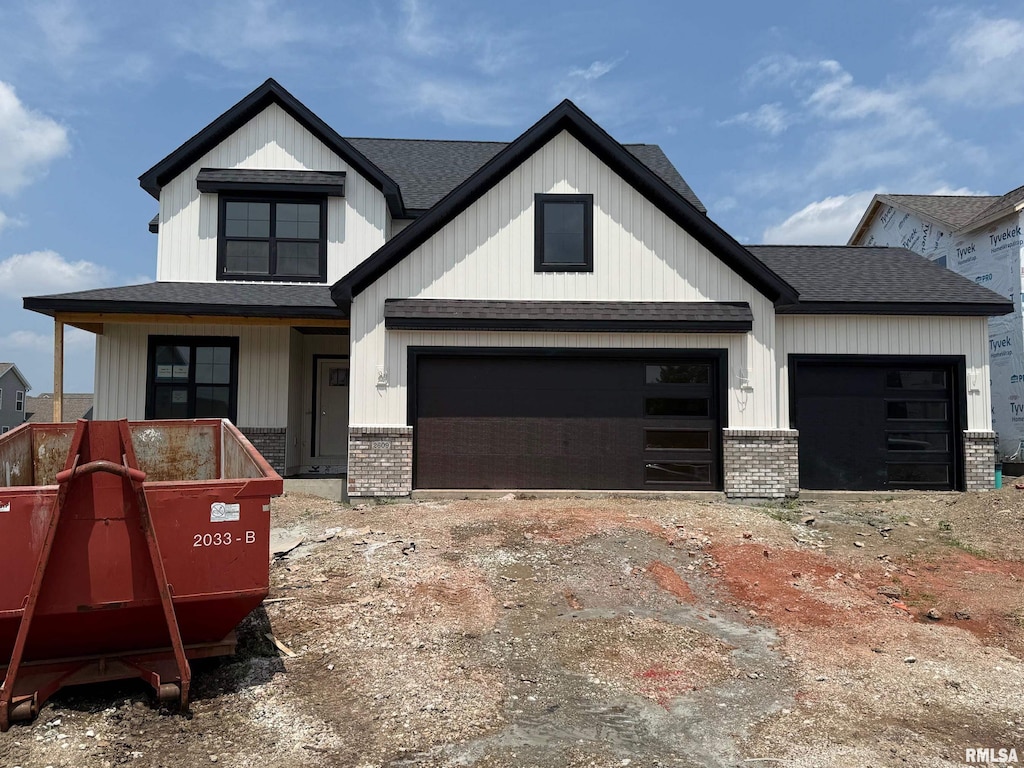 2609 W Arden Way, Dunlap, IL 61525 - view of front of house featuring brick siding, a shingled roof, a garage, and covered porch