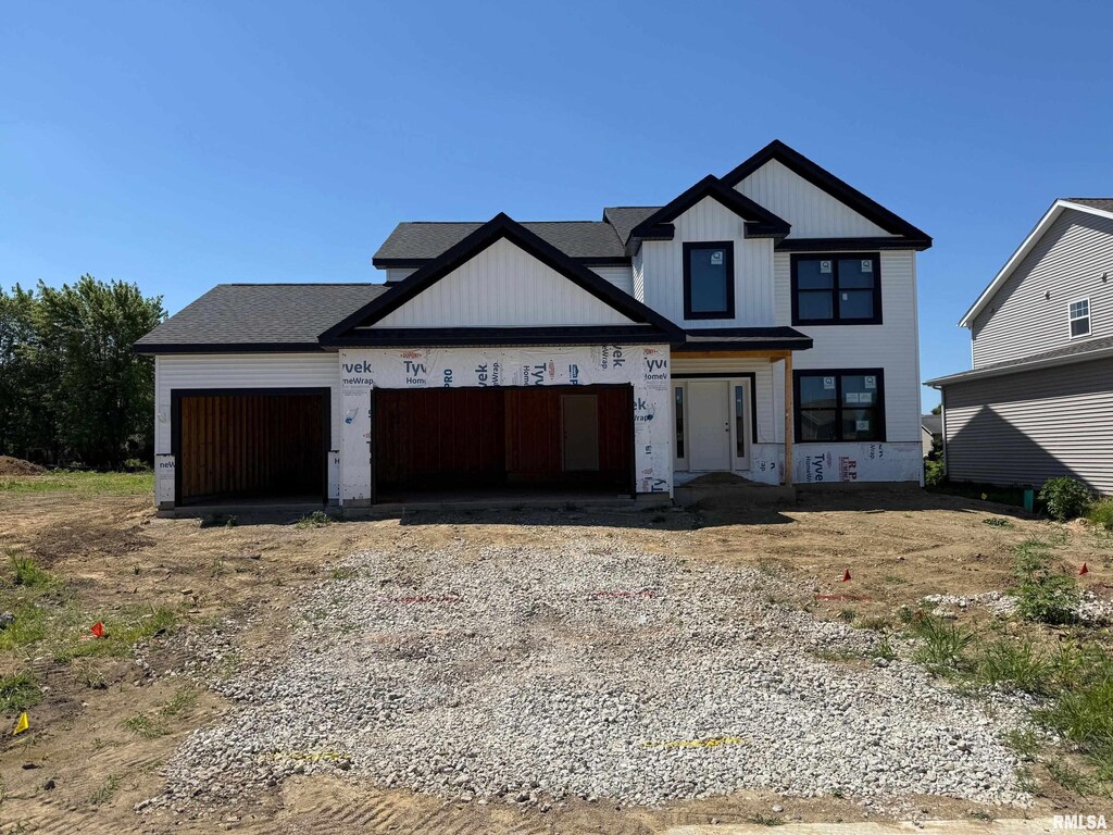 2610 W Arden Way, Dunlap, IL 61525 - unfinished property featuring gravel driveway and an attached garage