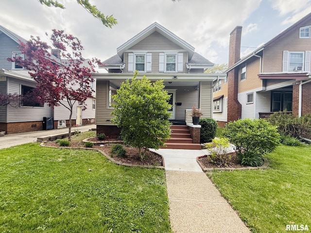 view of front of home featuring covered porch and a front lawn