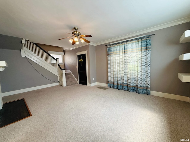 unfurnished living room with ornamental molding, stairs, a ceiling fan, and baseboards