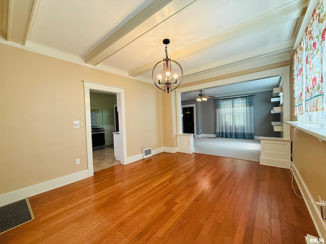 unfurnished room featuring crown molding, beamed ceiling, visible vents, and hardwood / wood-style flooring