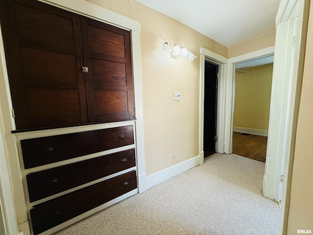 unfurnished bedroom with carpet flooring and baseboards
