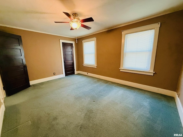unfurnished bedroom featuring baseboards, ornamental molding, a ceiling fan, and carpet flooring