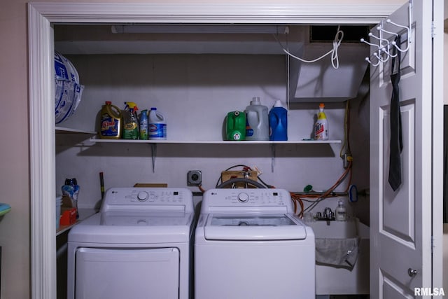 laundry room with a sink, independent washer and dryer, and laundry area