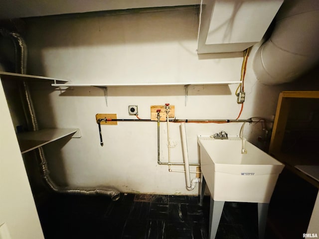 utility room with a sink