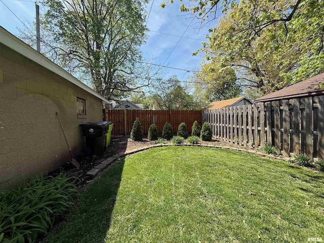 view of yard with a fenced backyard