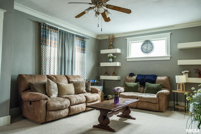 living room with crown molding, a ceiling fan, and carpet flooring