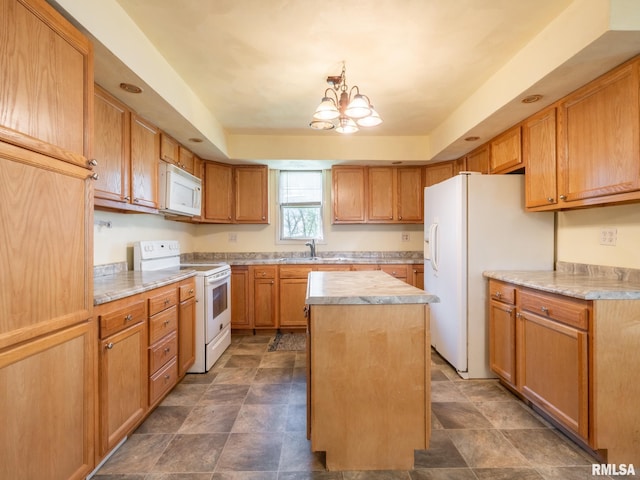 kitchen featuring an inviting chandelier, a sink, white appliances, a kitchen island, and light countertops