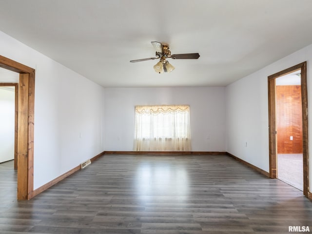 unfurnished room featuring visible vents, ceiling fan, and wood finished floors