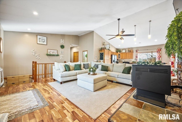 living room with recessed lighting, a ceiling fan, high vaulted ceiling, and light wood-style floors