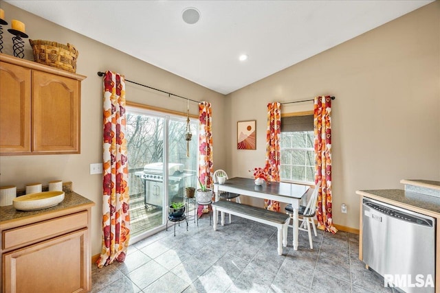 dining space featuring recessed lighting, vaulted ceiling, and baseboards