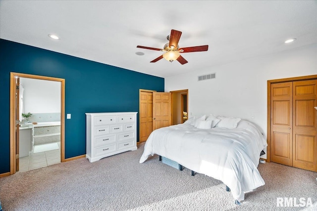 bedroom with ensuite bath, visible vents, recessed lighting, and carpet flooring