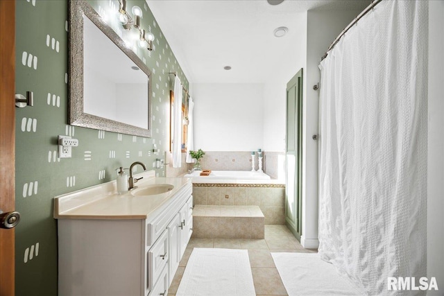 bathroom with a shower with shower curtain, a garden tub, tile patterned flooring, and vanity