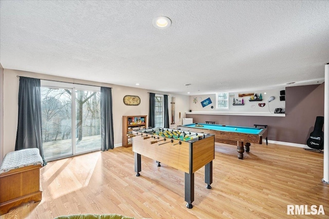 game room with baseboards, a textured ceiling, billiards, and light wood finished floors