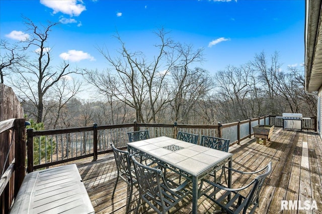 deck with outdoor dining space