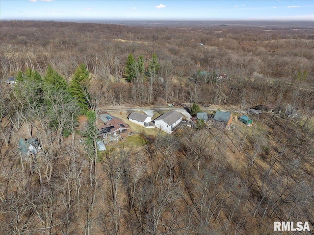 bird's eye view featuring a forest view