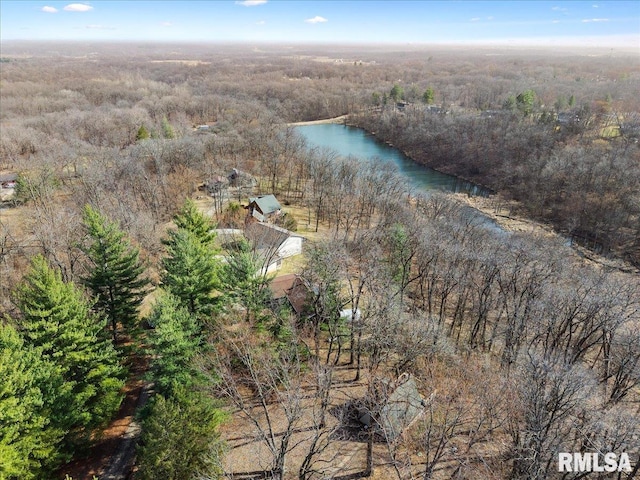 drone / aerial view featuring a water view and a forest view