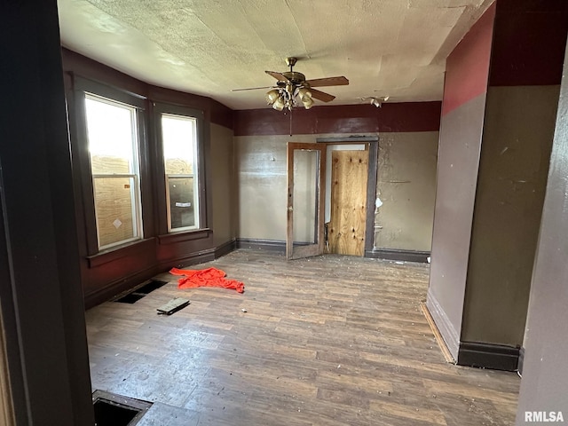 707 E Ravine Ave, Peoria, IL 61603 - unfurnished room featuring a ceiling fan, wood finished floors, and baseboards