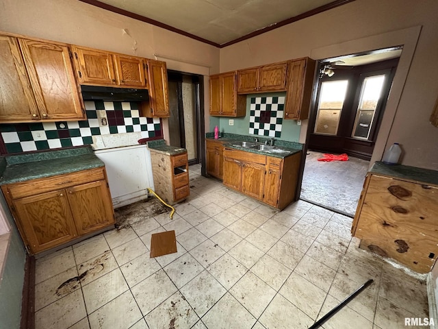 707 E Ravine Ave, Peoria, IL 61603 - kitchen featuring ornamental molding, brown cabinetry, and tasteful backsplash