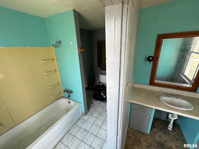 707 E Ravine Ave, Peoria, IL 61603 - full bathroom with tile patterned floors, vanity, and  shower combination