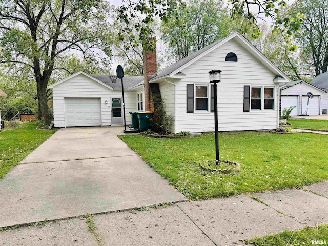 711 E Piper St, Macomb, IL 61455 - ranch-style home with a front yard, concrete driveway, a garage, and a chimney