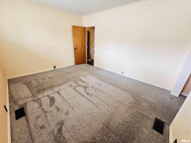 711 E Piper St, Macomb, IL 61455 - carpeted spare room with baseboards