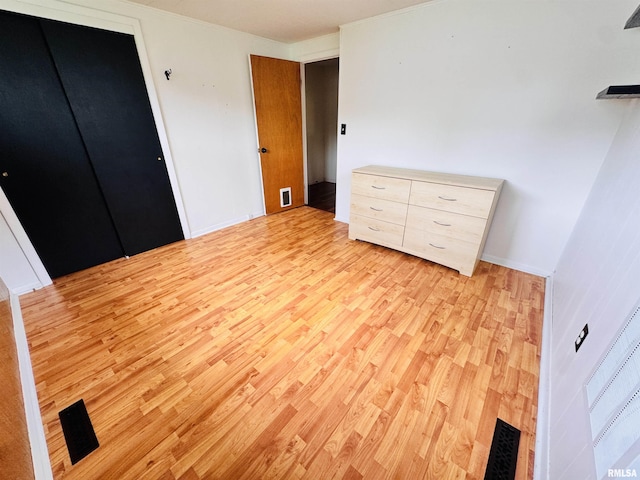 711 E Piper St, Macomb, IL 61455 - unfurnished bedroom with light wood finished floors