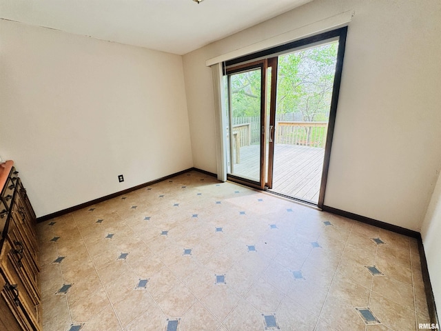 711 E Piper St, Macomb, IL 61455 - empty room featuring baseboards and light tile patterned floors