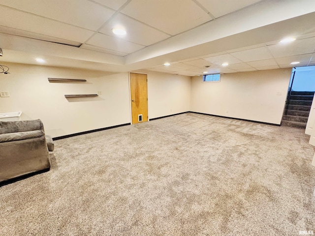 711 E Piper St, Macomb, IL 61455 - below grade area with carpet flooring, baseboards, stairs, a paneled ceiling, and recessed lighting
