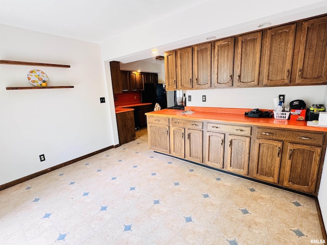 711 E Piper St, Macomb, IL 61455 - kitchen with baseboards and light countertops