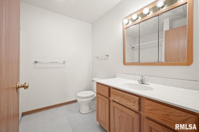 25633 N County Road 2500 E, Manito, IL 61546 - bathroom with vanity, toilet, baseboards, and tile patterned floors