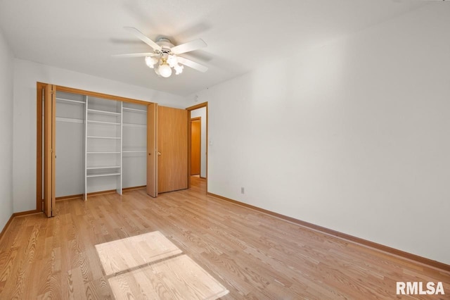 25633 N County Road 2500 E, Manito, IL 61546 - unfurnished bedroom with light wood-type flooring, baseboards, a closet, and ceiling fan