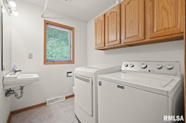 25633 N County Road 2500 E, Manito, IL 61546 - laundry area featuring baseboards, washing machine and dryer, and light tile patterned floors